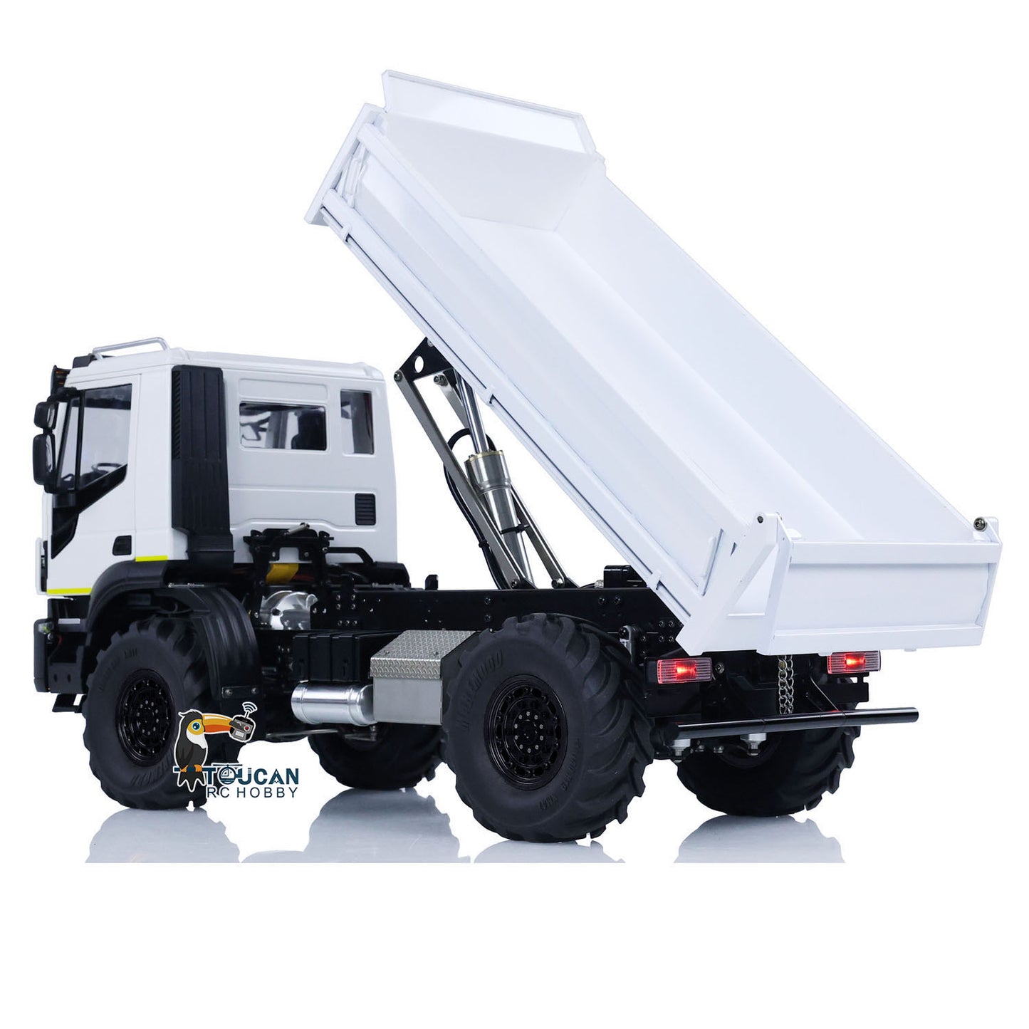 1/14 RC 4x4 Hydraulic Dump Truck MD-4x4 left side profile with monster tires and hydraulic cylinder